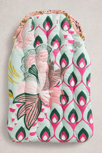 Patterned hot water bottle with floral design on a light background