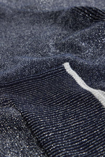 Close-up of textured dark grey fabric with a subtle pattern
