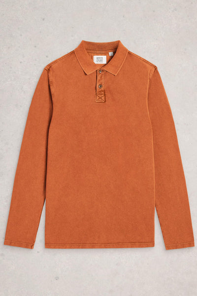 Flat lay of fairtrade cotton long sleeve orange polo on neutral background