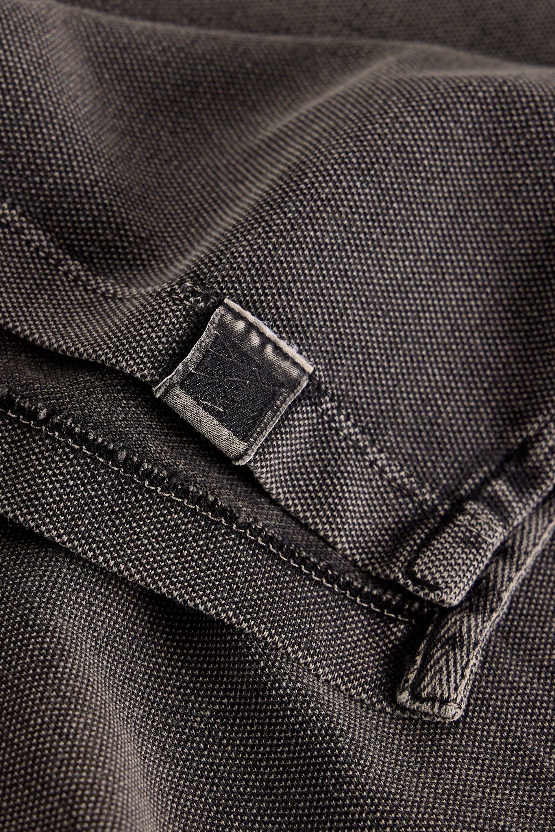 Close-up of a black fabric with stitching details