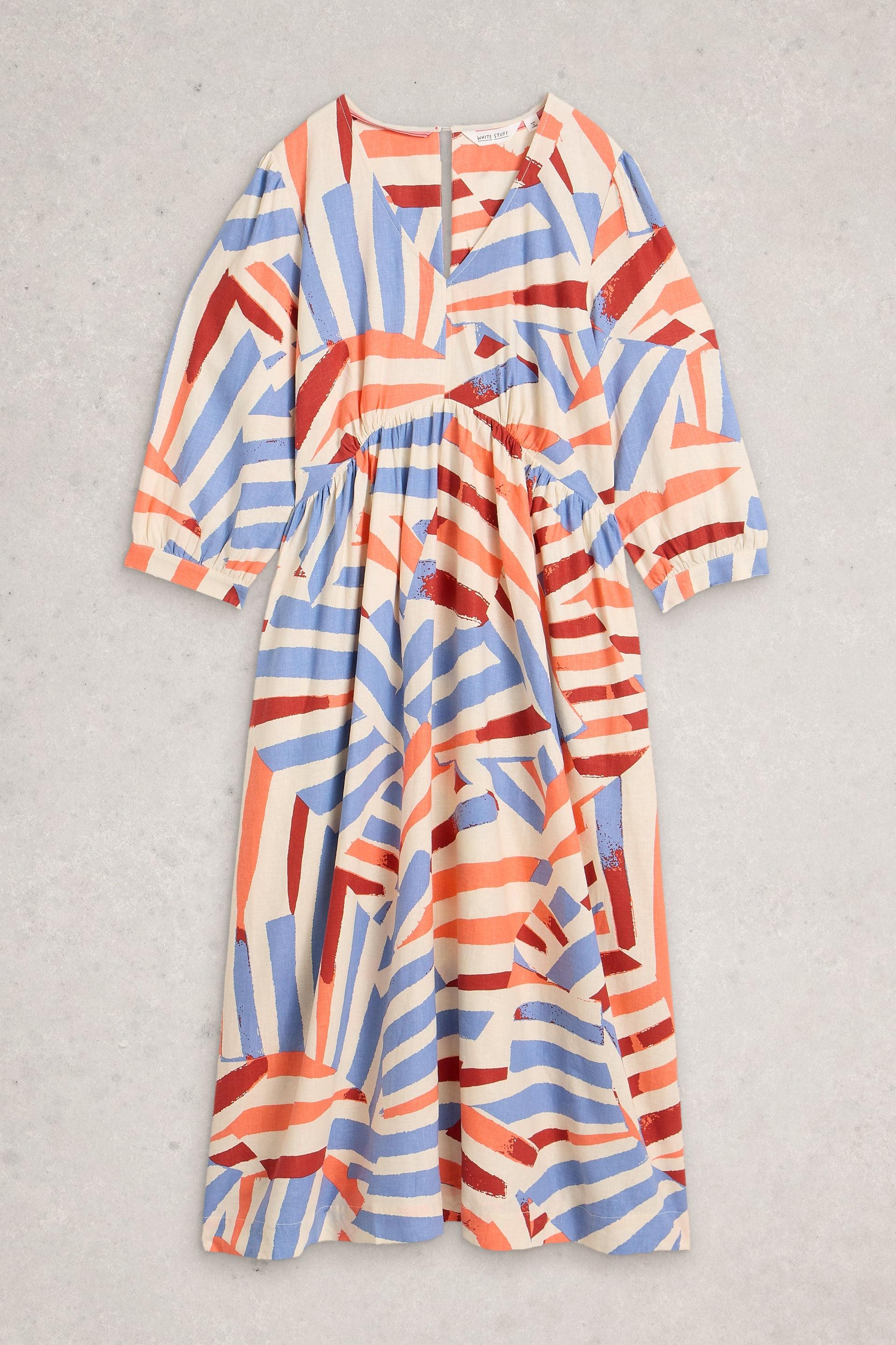 Colorful patterned dress on a gray background