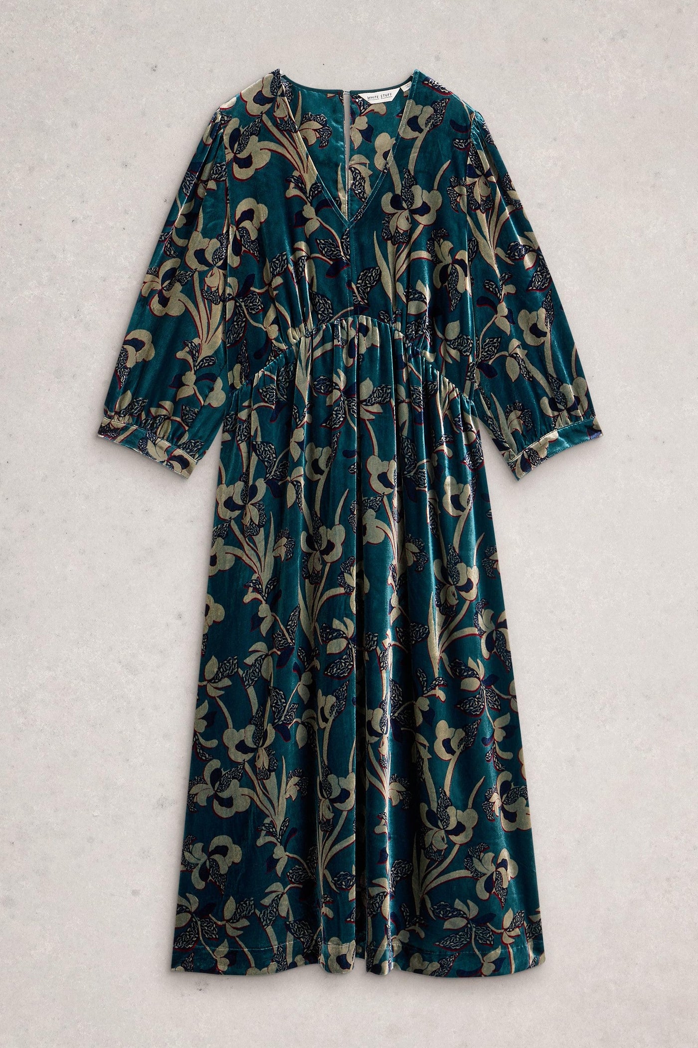 Long-sleeve velvet dress with floral pattern on a light gray background