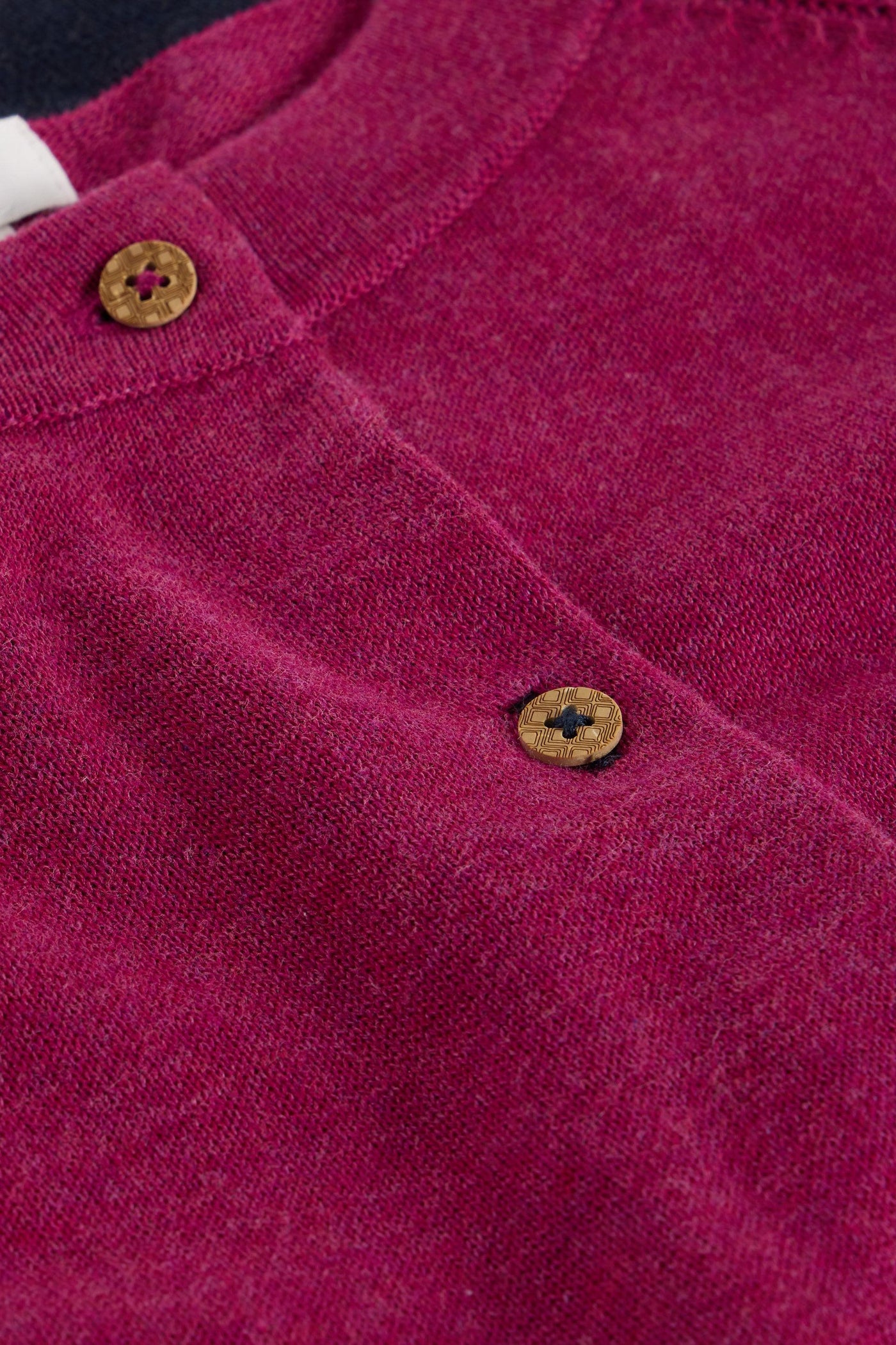 Close up of buttons on organic cotton plum cardigan