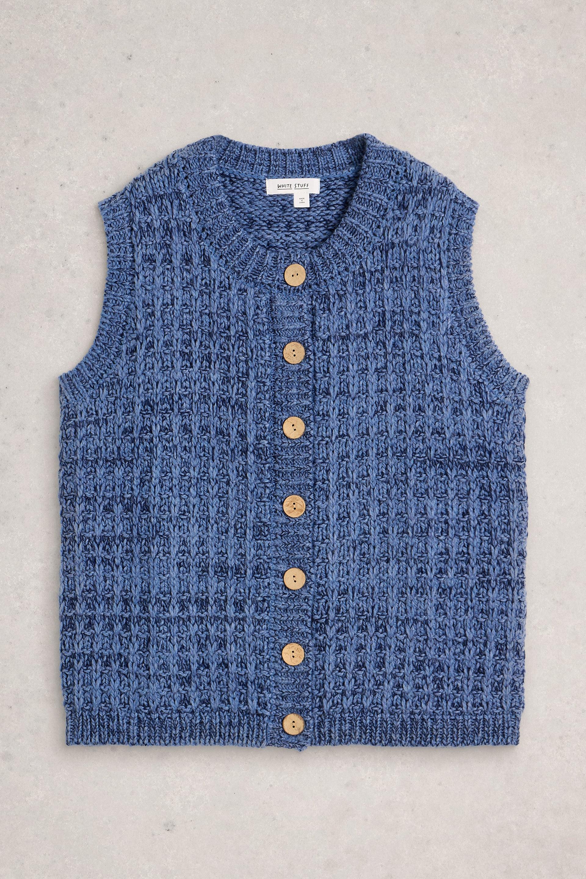 Blue knitted wool vest with buttons on a gray background