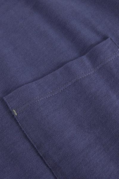 Close-up of a purple organic cotton texture with stitching detail