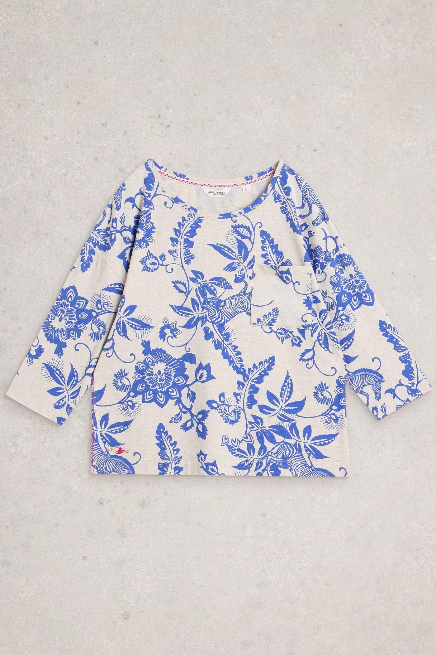 Blue floral patterned shirt on a gray background