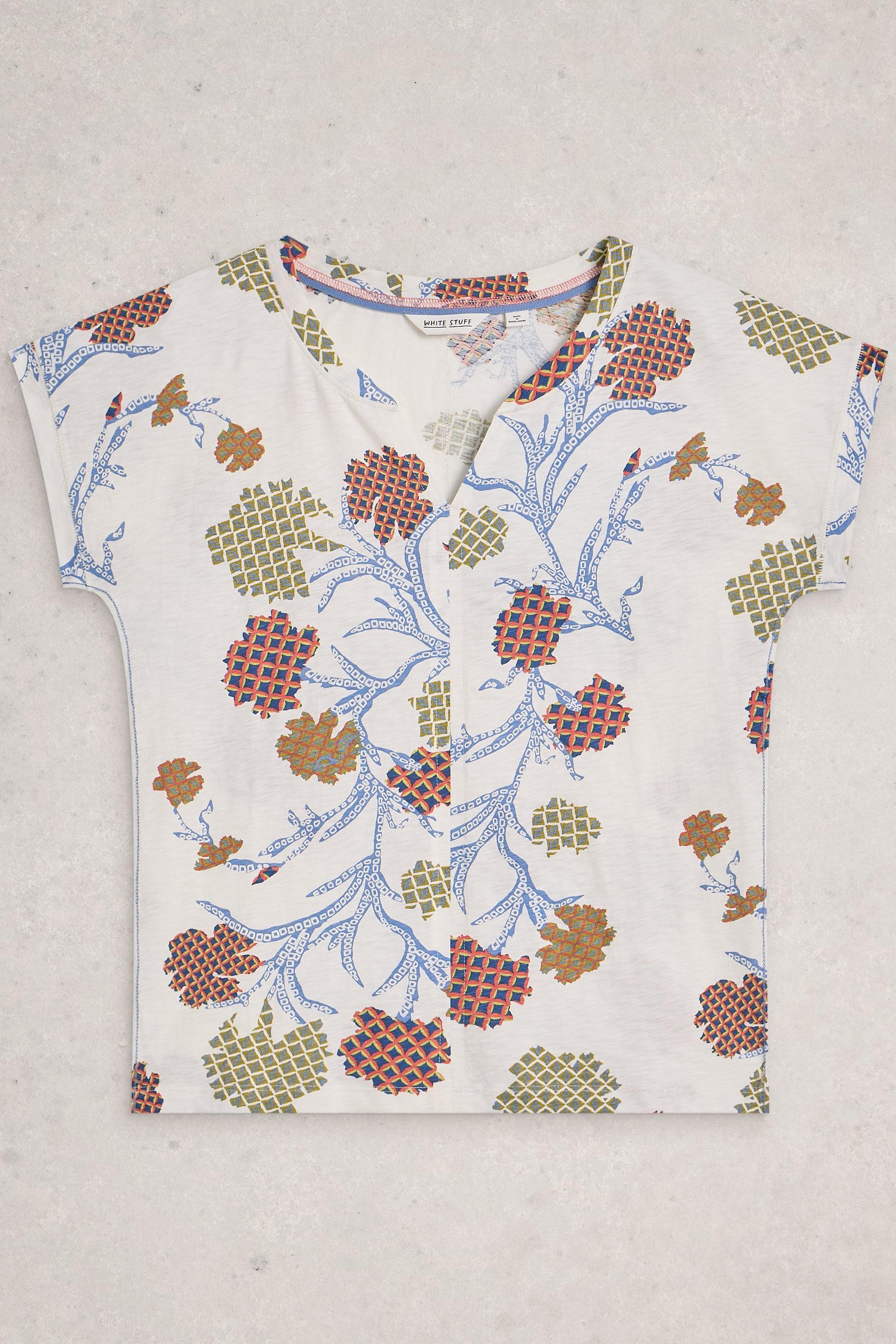 Floral patterned cotton top on a plain background