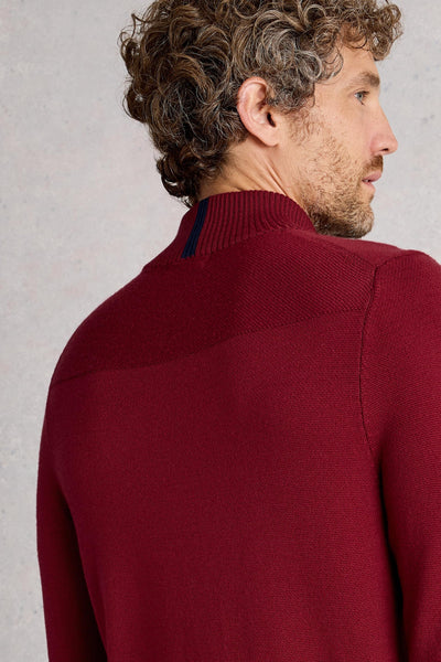 Back view of ribbed neck on a red merino wool long-sleeve knit