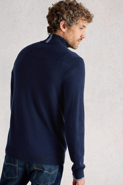 Back view of navy merino long sleeve knit with light blue detail on neck and sleeve