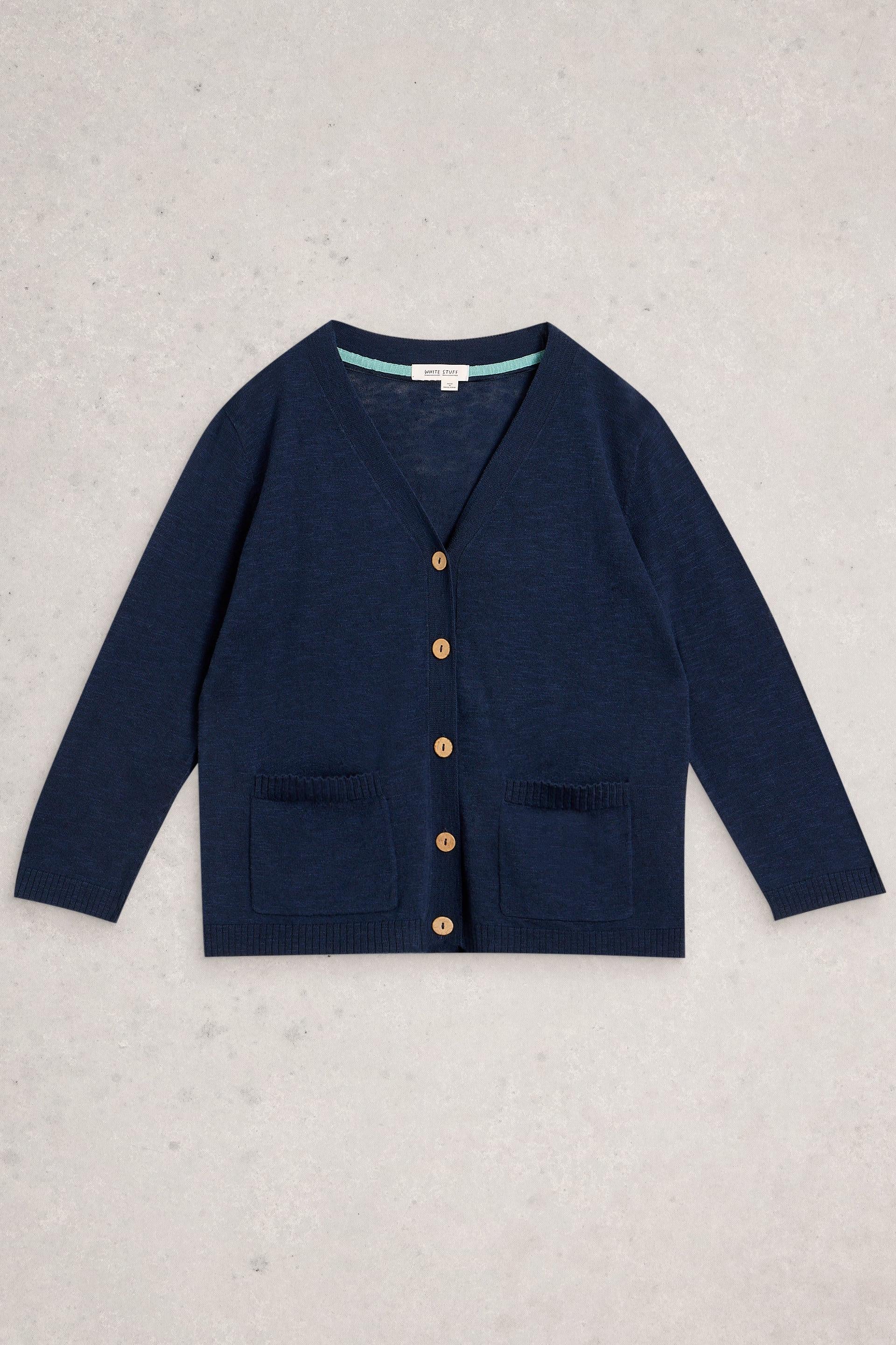 Navy blue organic cotton cardigan with button details on a light gray background