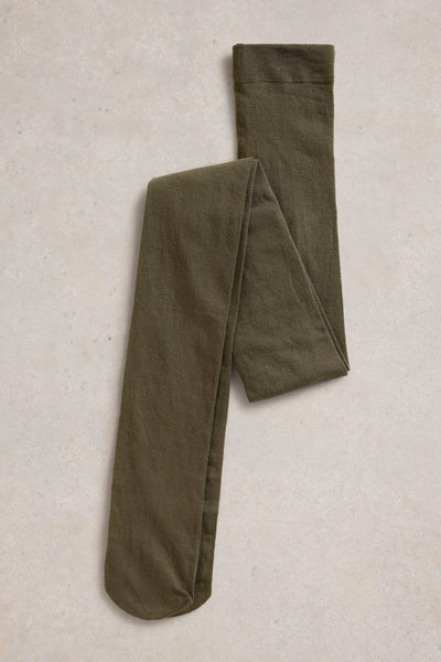 Folded olive green tights on a beige textured background