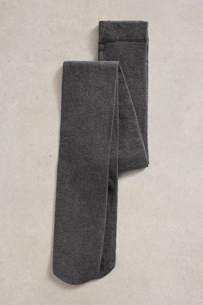 Folded gray organic cotton tights on a beige surface