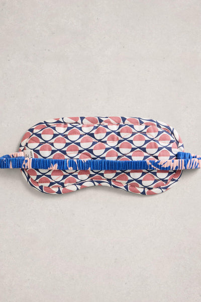 Organic cotton sleep mask with geometric pattern on a light gray background
