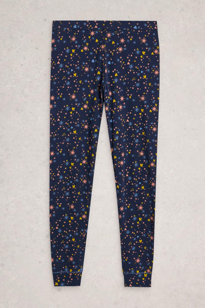 Navy pyjama leggings with colourful star pattern on a light gray background