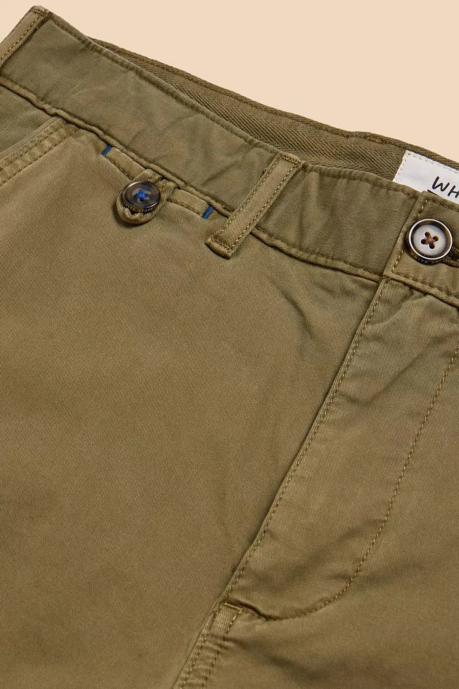 Close up of belt loops and zip on organic cotton chino shorts