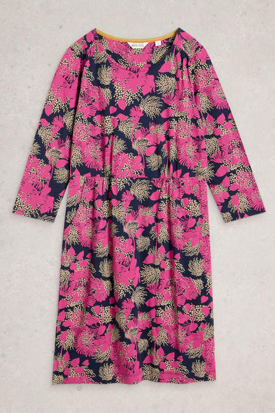 Knee-length organic cotton dress in pink floral print, folded flat on a neutral background