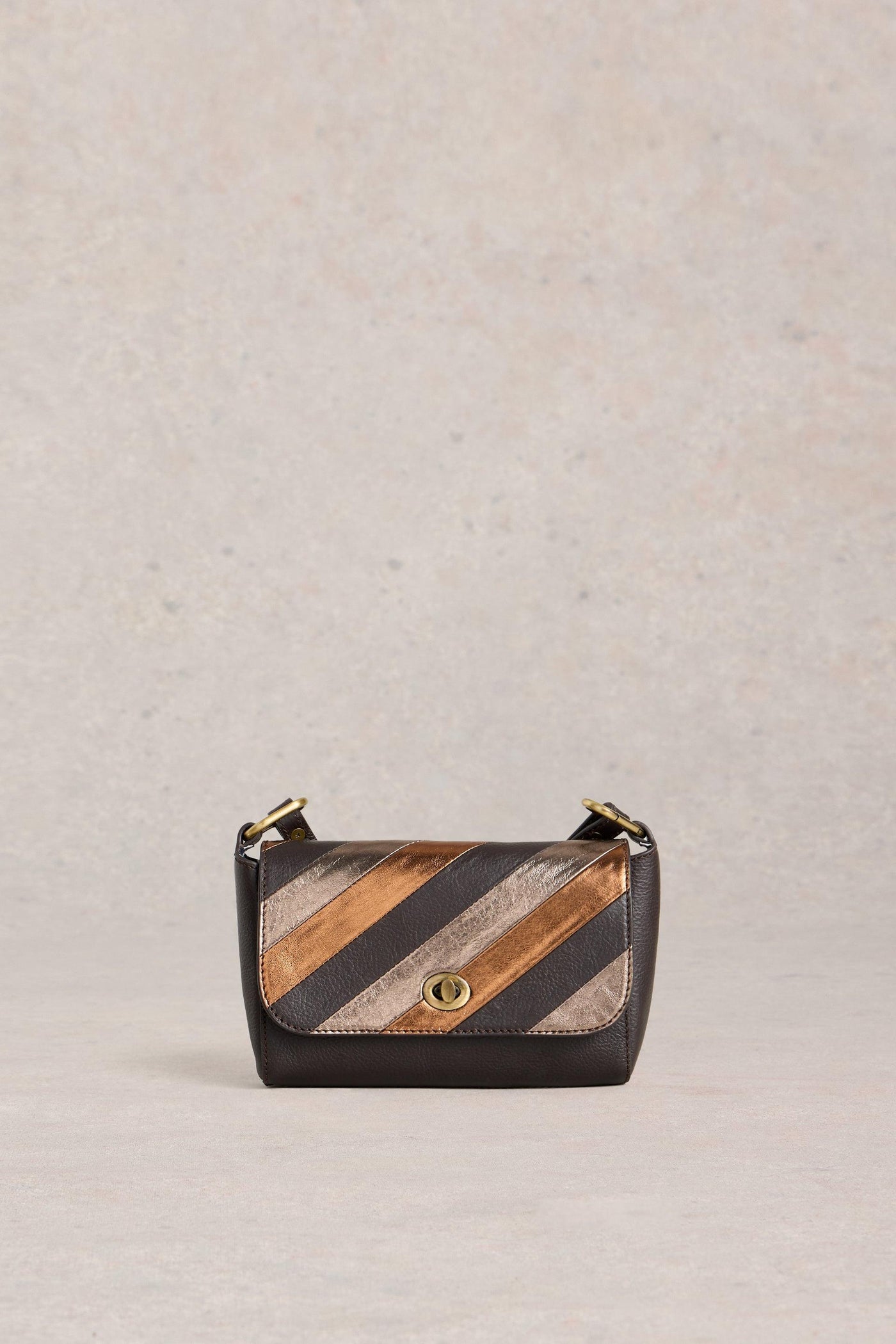 Handbag with striped pattern on a beige background