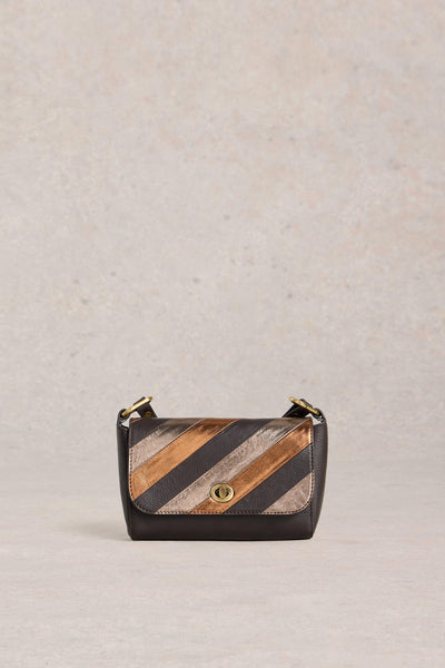 Handbag with striped pattern on a beige background