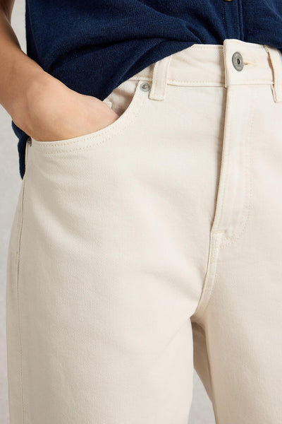 Close-up of pocket detail on white straight leg organic cotton jeans
