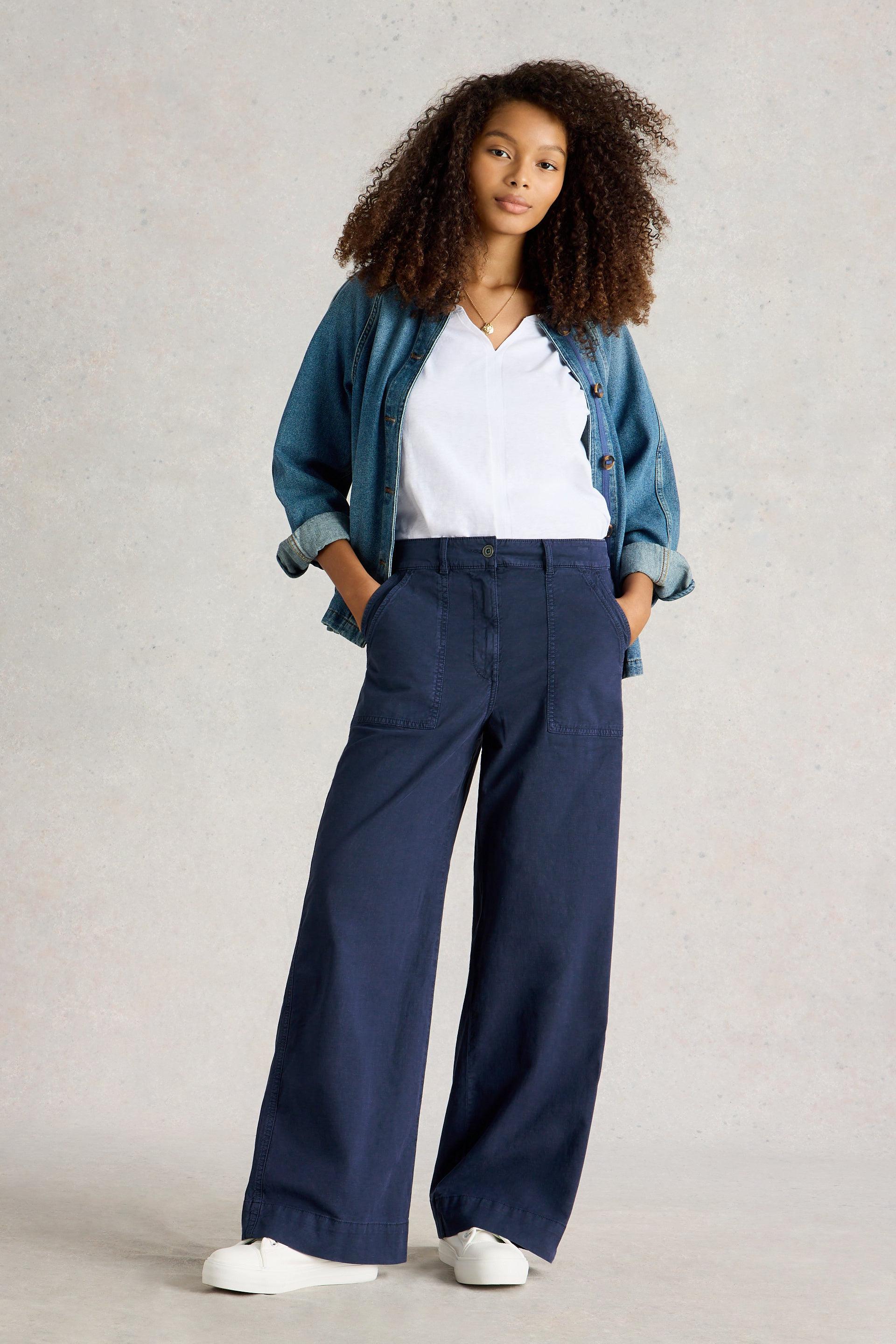 Front view of model wearing the White Stuff Twister Chino Wide Leg Trousers in Dark Navy, highlighting the wide-leg cut and relaxed fit.