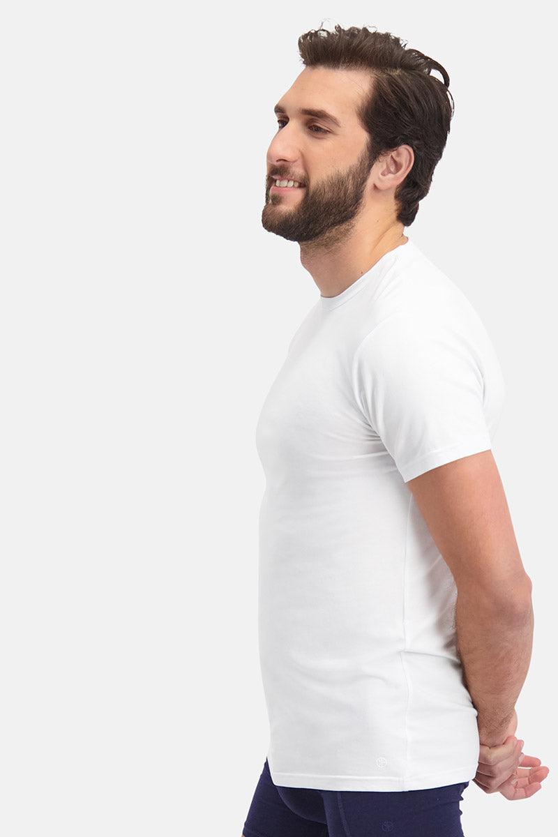 A bearded man in profile wearing a white bamboo fiber t-shirt against a light gray background