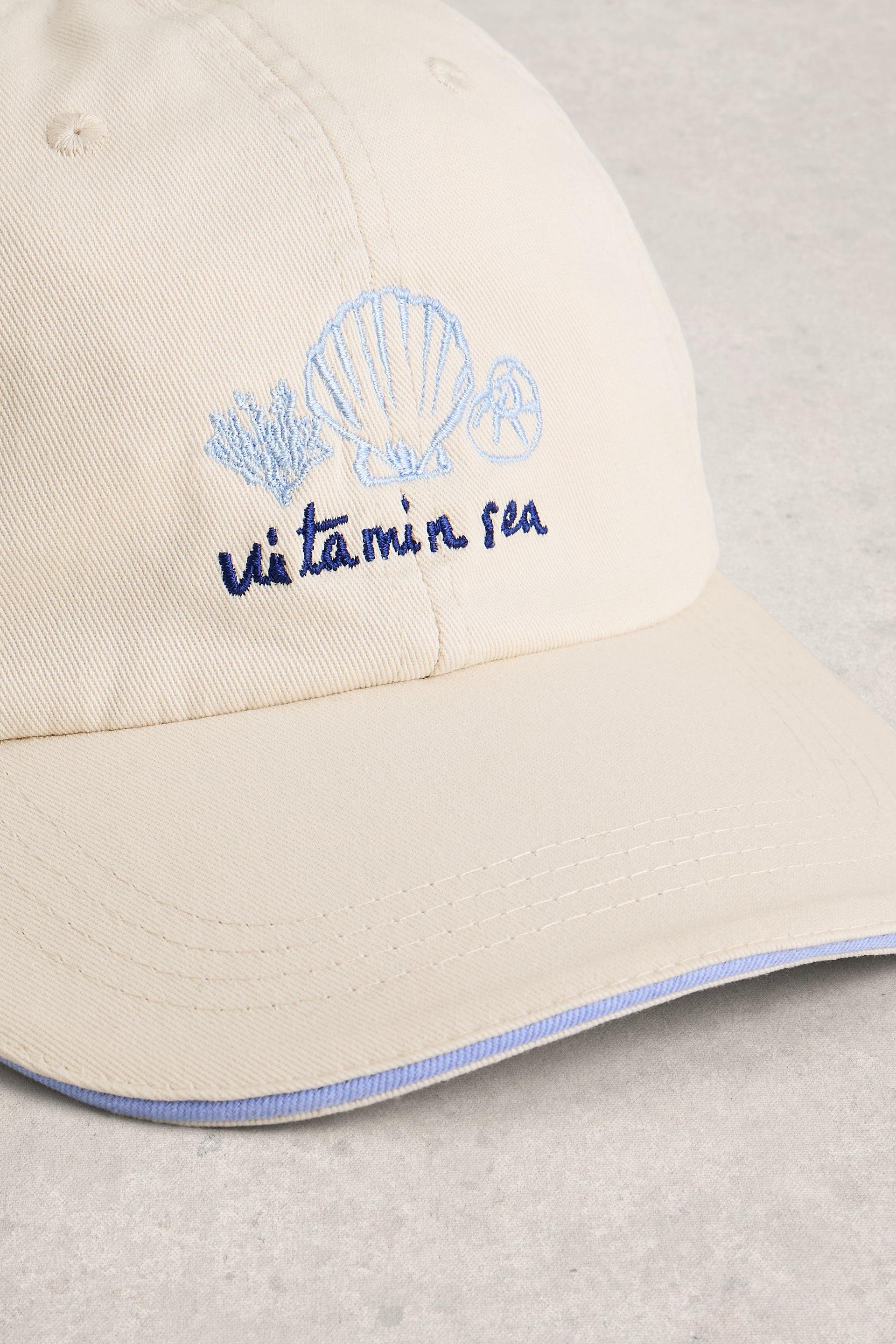 Beige cap with 'Vitamin Sea' and shell embroidery