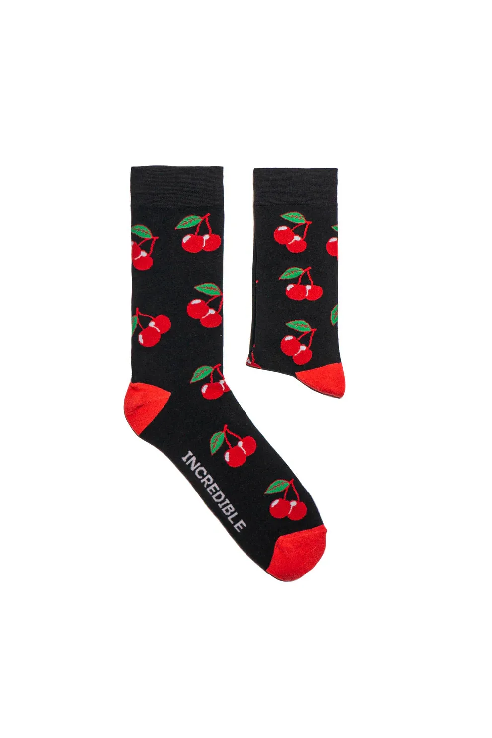 A pair of black crew socks featuring a red cherry pattern and the word Incredible on the side