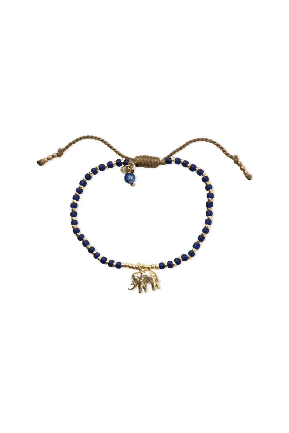 Bracelet with blue beads and gold elephant charm on a white background