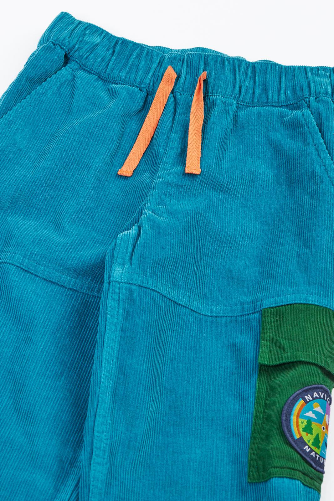 Frugi blue cord trousers with orange drawstrings and green cargo pockets made from organic cotton