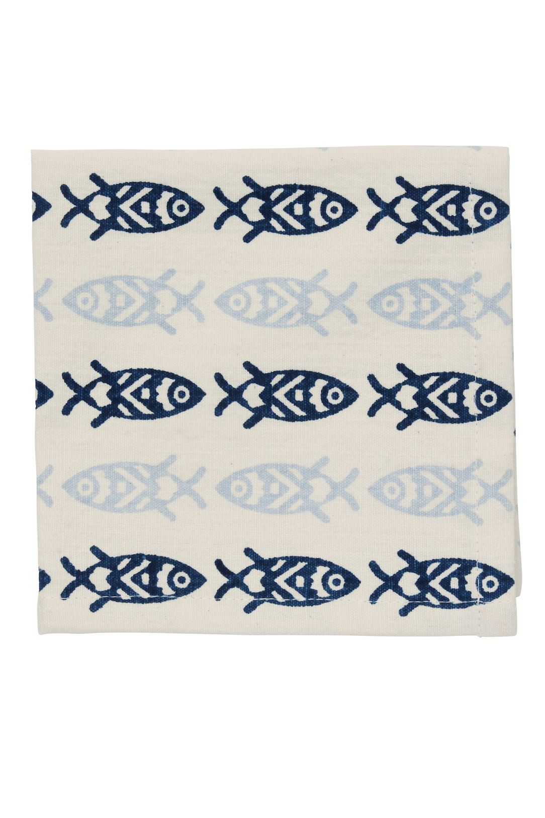 Folded cotton napkin with a repeating blue and light blue fish pattern on a cream background.