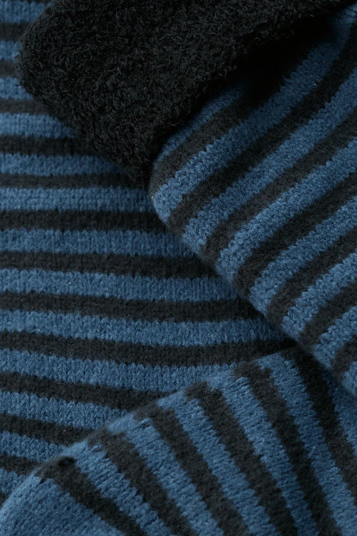 Close-up of soft blue stripe fluffy men's socks by Seasalt Cornwall