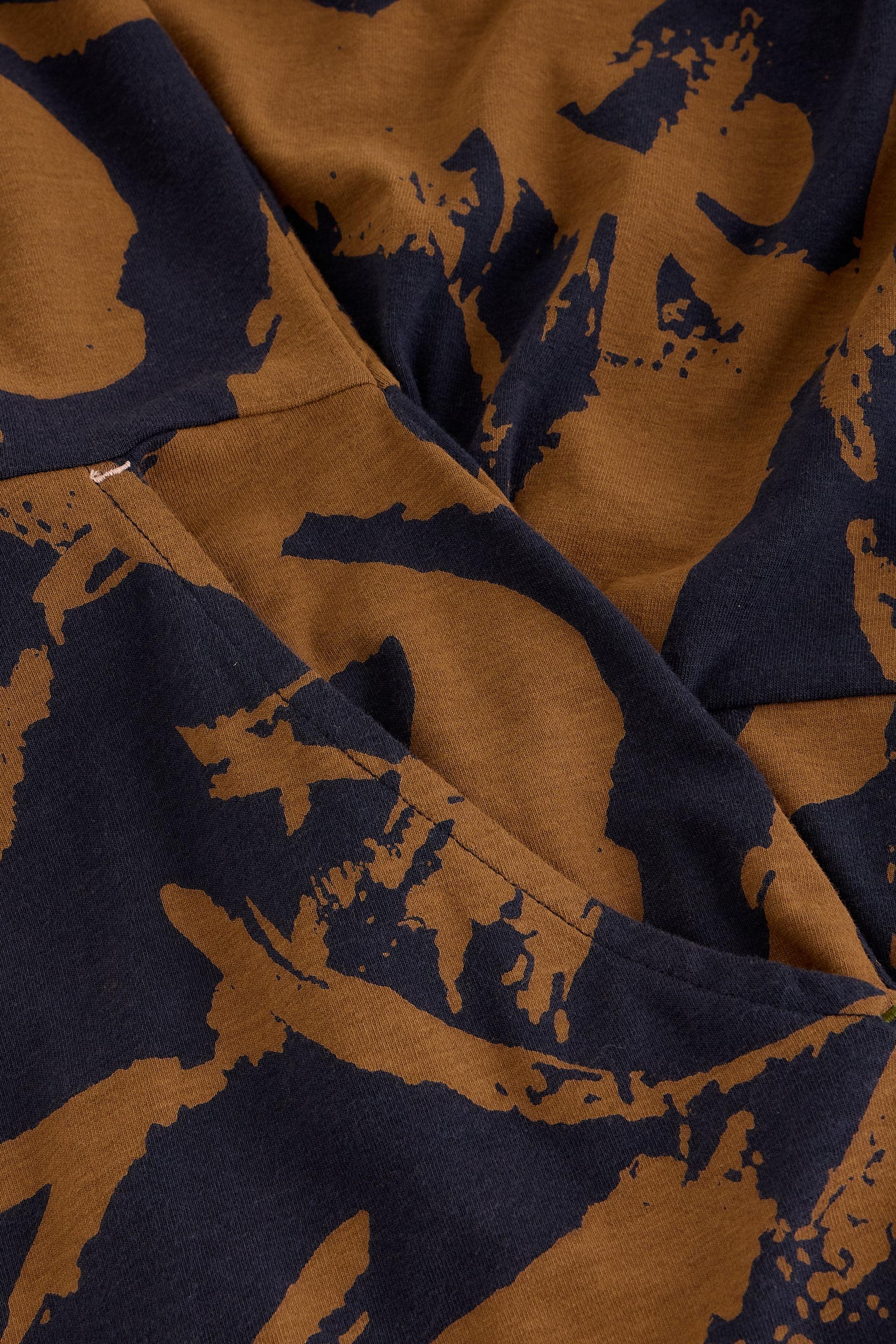 Close-up of soft brown and black abstract patterned organic cotton fabric texture