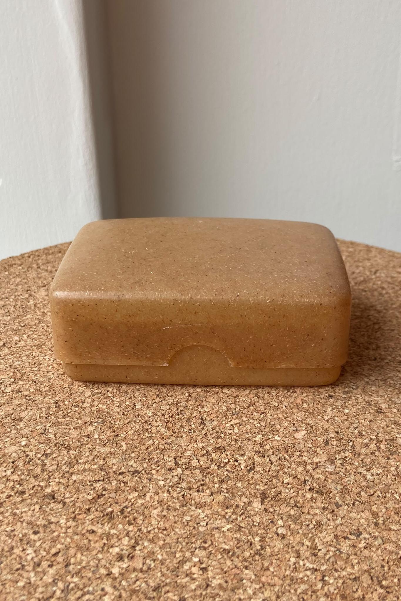 Brown soap box on cork surface