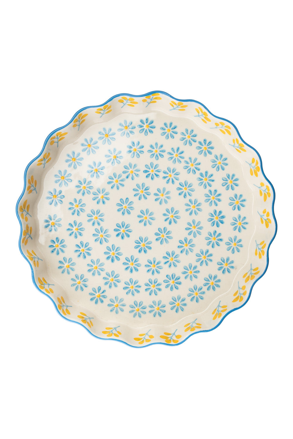 Decorative quiche dish with floral pattern on a white background