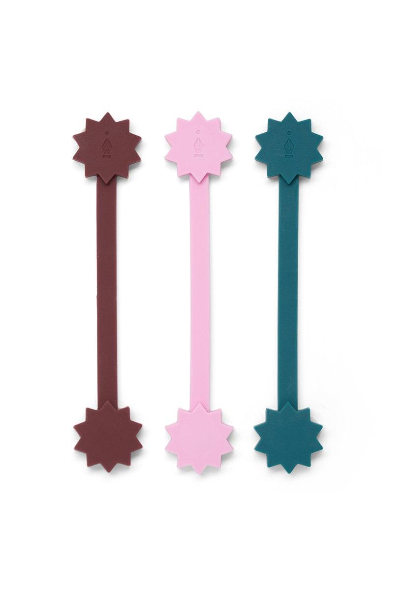 Three colourful silicone straws with star-shaped ends on a white background