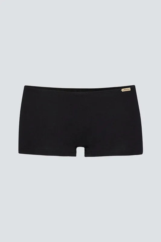 Black Comazo short briefs made from organic cotton on a neutral background.