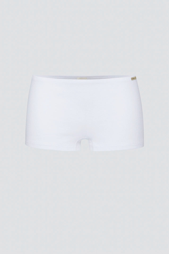 A pair of plain white Comazo women's briefs made from organic cotton, set against a soft grey background.
