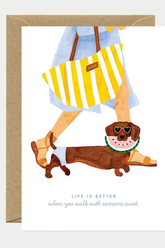 Watercolor illustration of a dachshund wearing sunglasses and watermelon slice, featured on a summer greeting card.