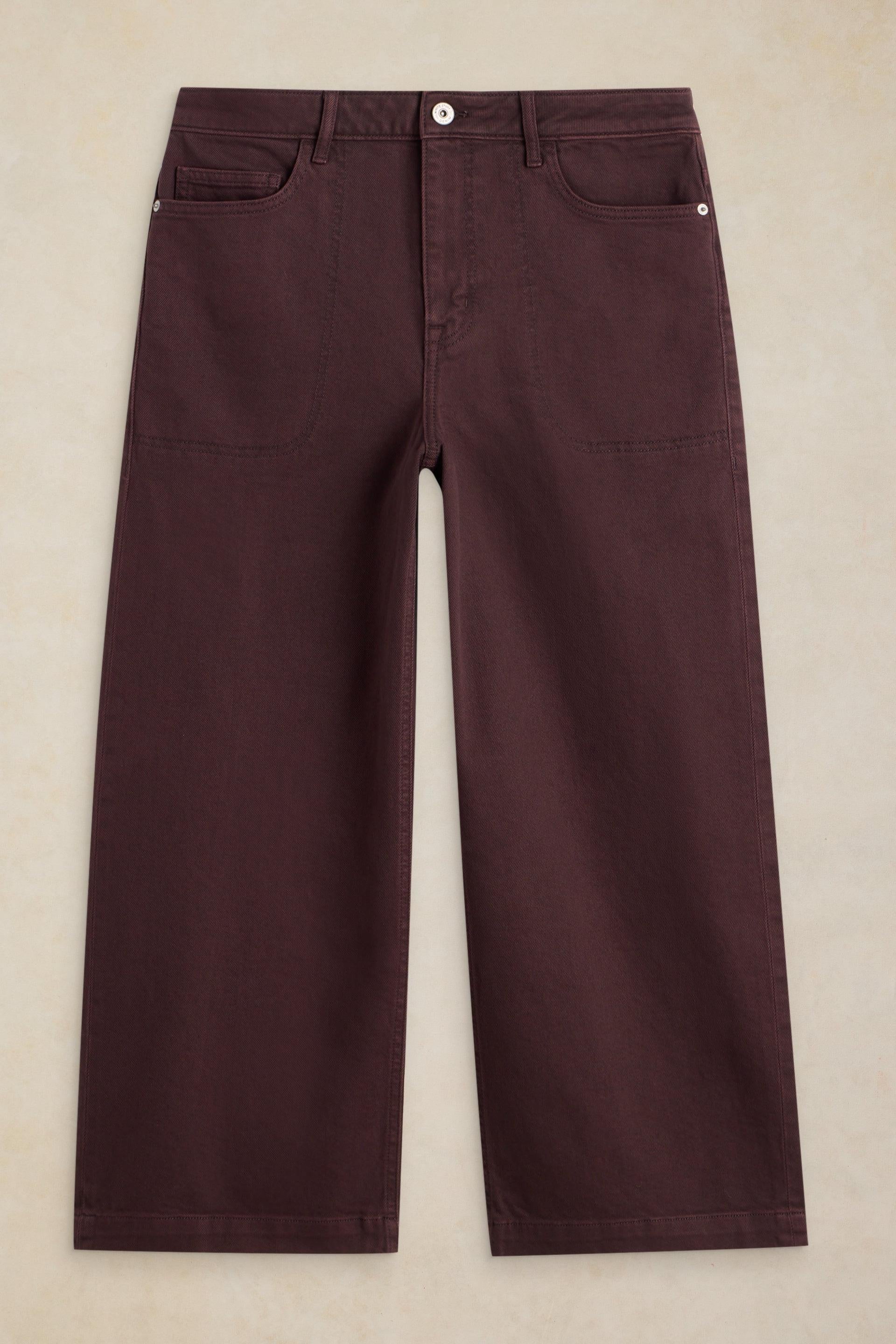 Front view of dark maroon wide-leg trousers made from organic cotton on a neutral background