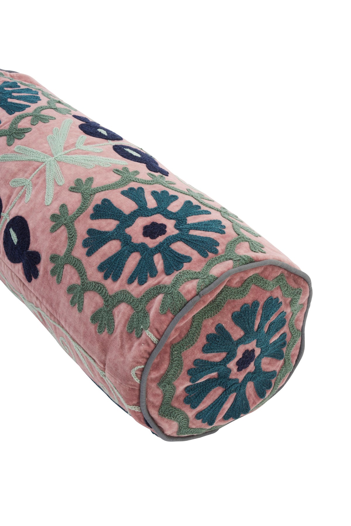 Pink velvet bolster cushion with detailed floral embroidery, ideal as a new home gift or decorative homeware.