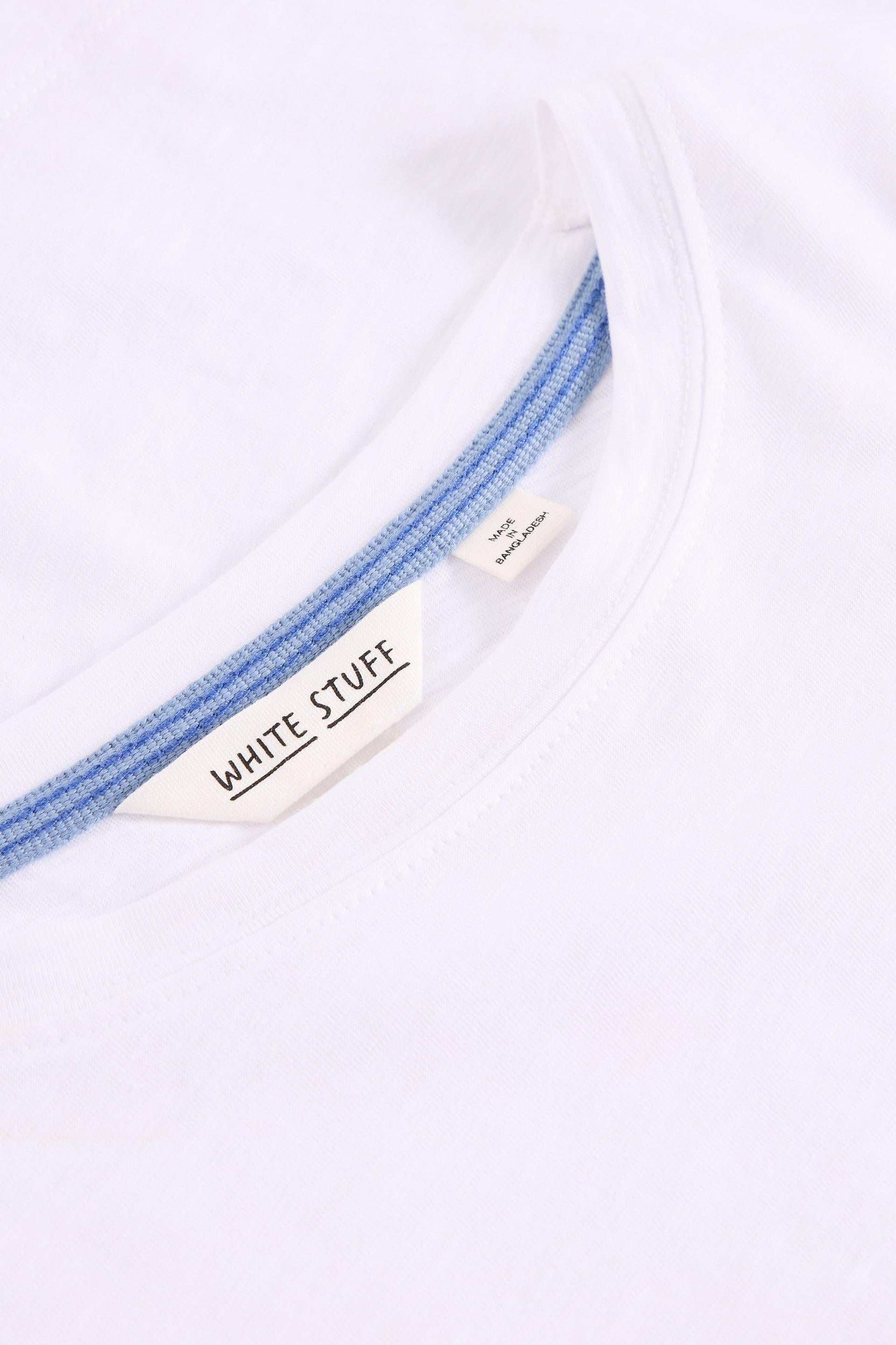 Close up of White Stuff label on white cotton t-shirt