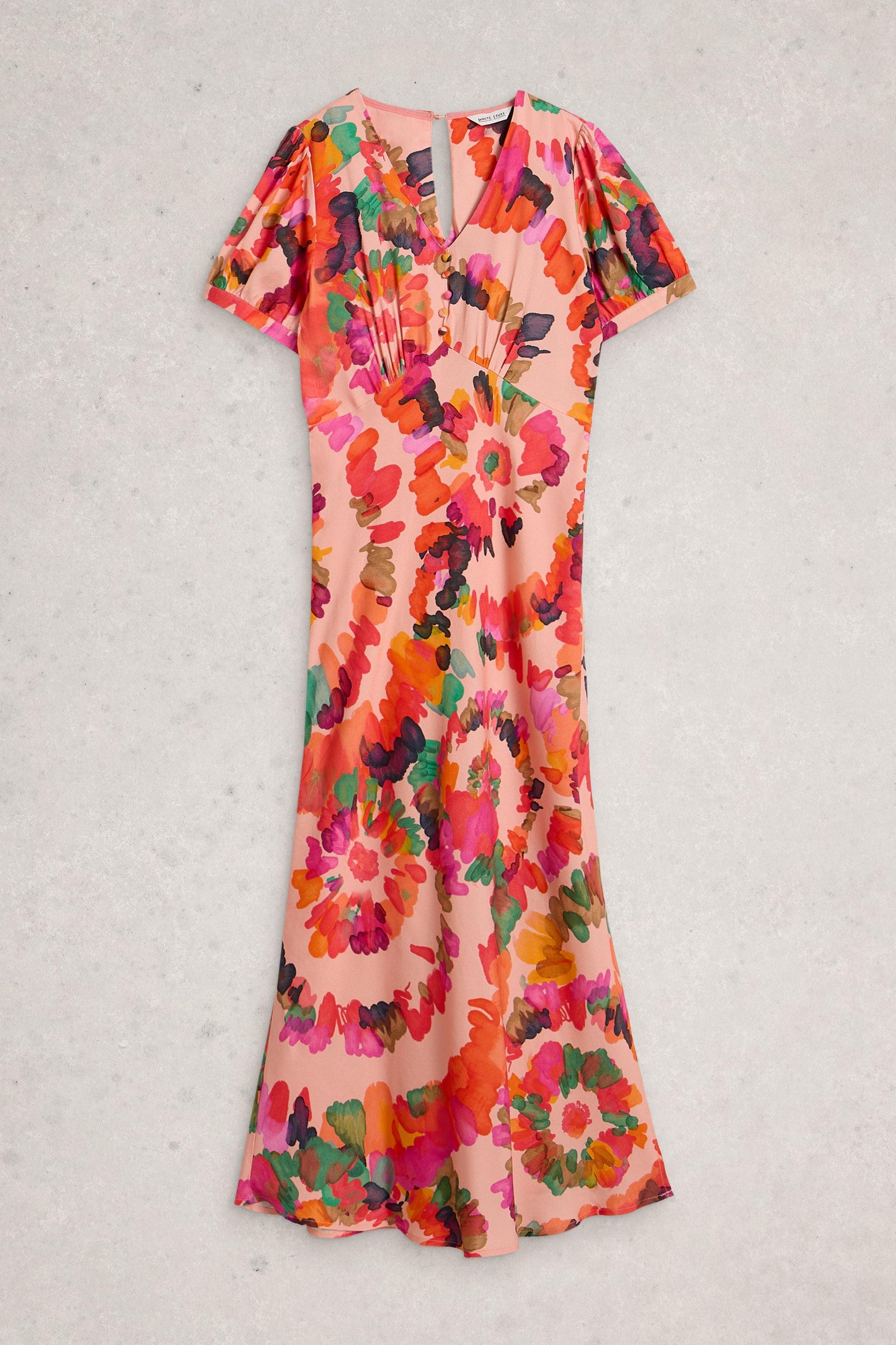 Pink floral occasion dress with short puff sleeves and a V-neckline against a neutral background.