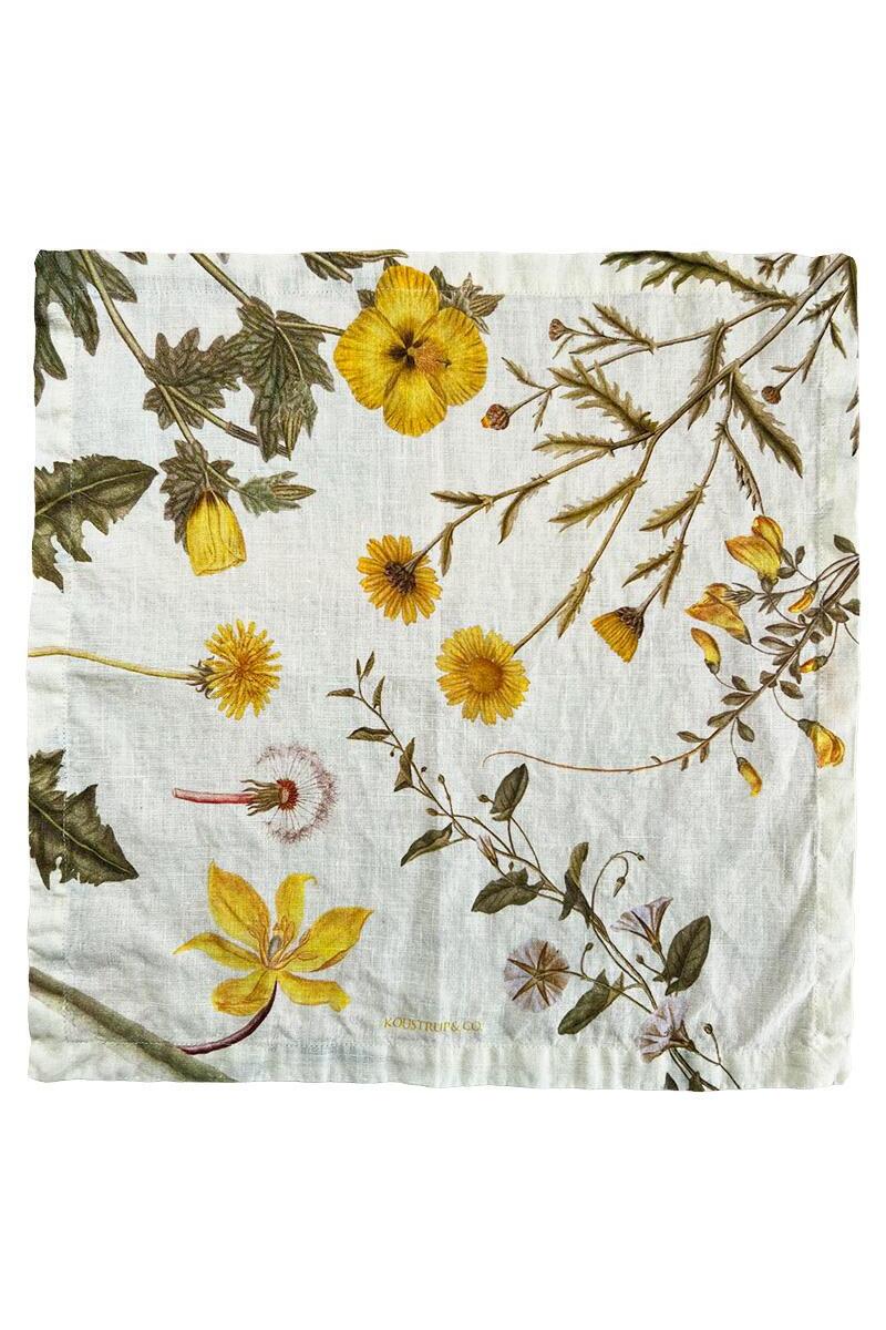 Floral patterned linen napkin with yellow flowers and green leaves on a white background