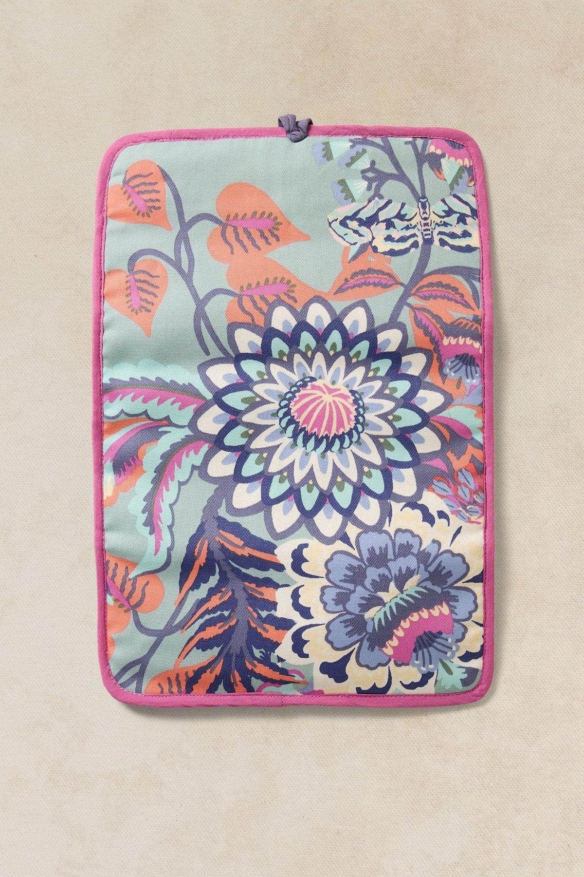 A rectangular travel organiser pouch featuring a vibrant multi-colored floral pattern on a light blue background.