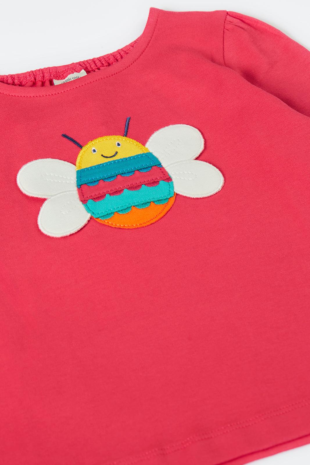 Red Frugi top with a colorful bee design on a white background