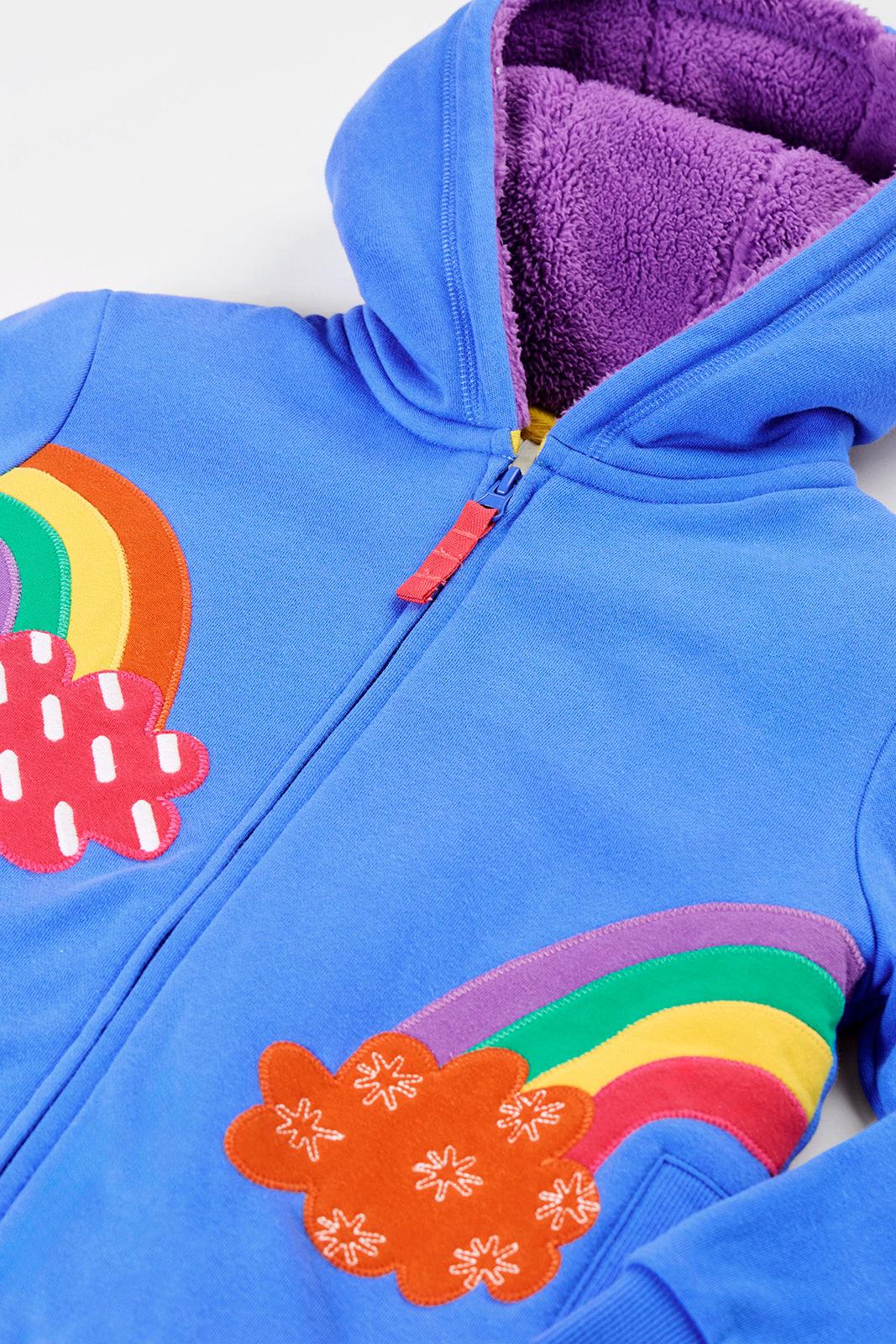 Bright blue girls jumper with colourful rainbow applique and warm purple fleece lining.