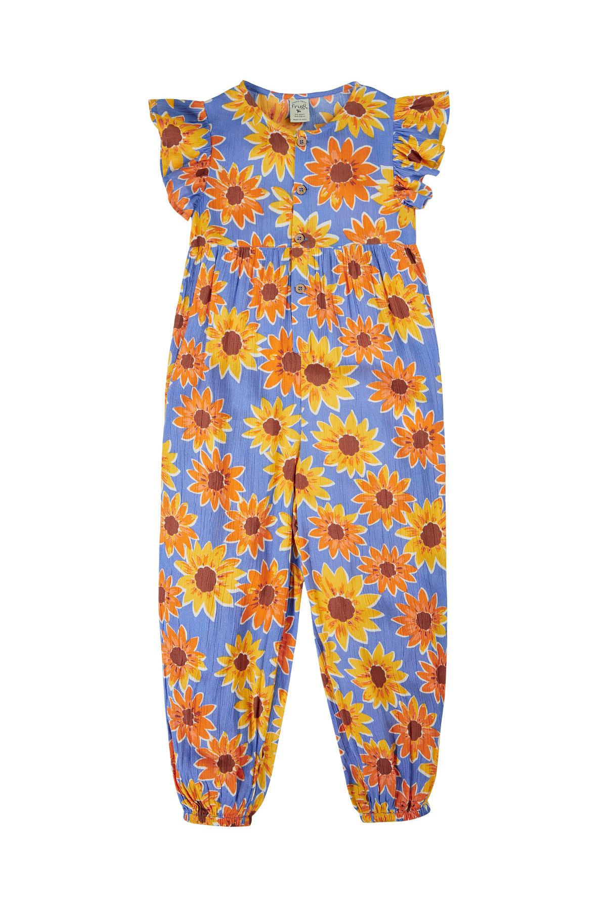 Frugi girls jumpsuit featuring a blue base with a vibrant yellow and orange sunflower print and ruffle sleeves.