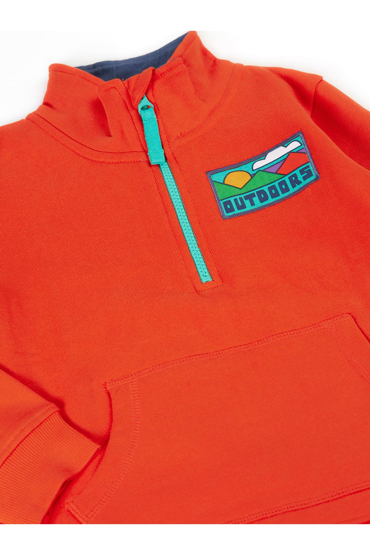 Orange pullover with a logo on the chest against a white background