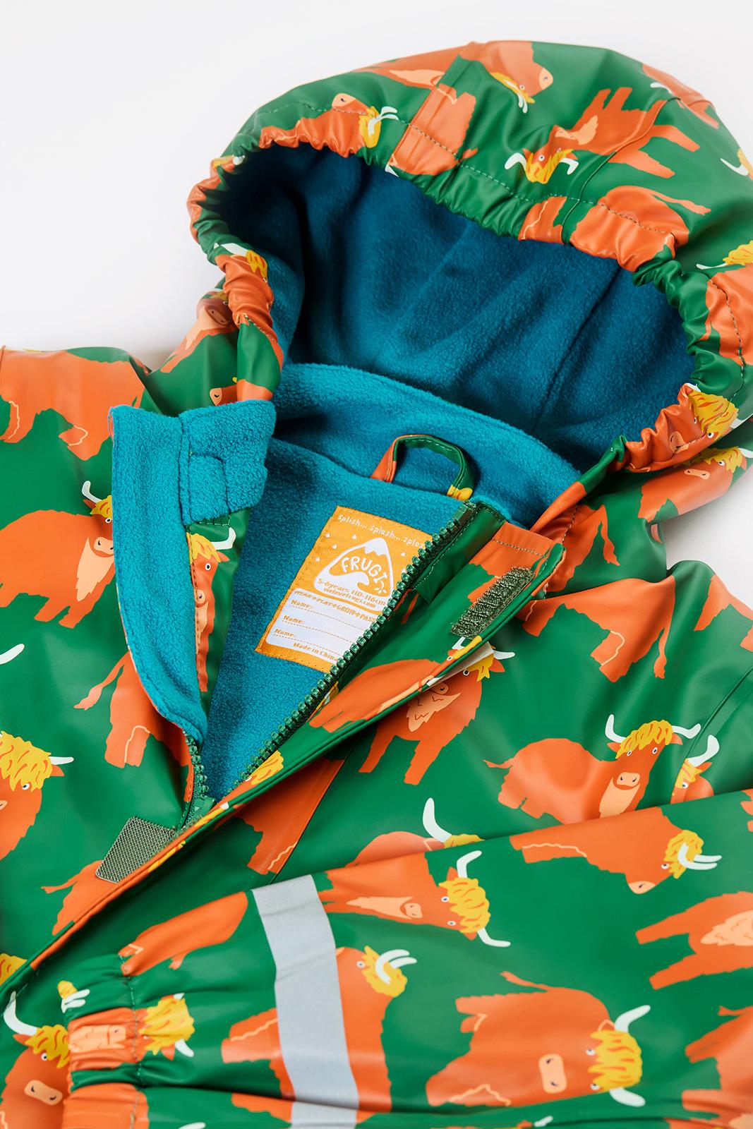Frugi children's waterproof raincoat with a green and orange highland cow print and fleece lining