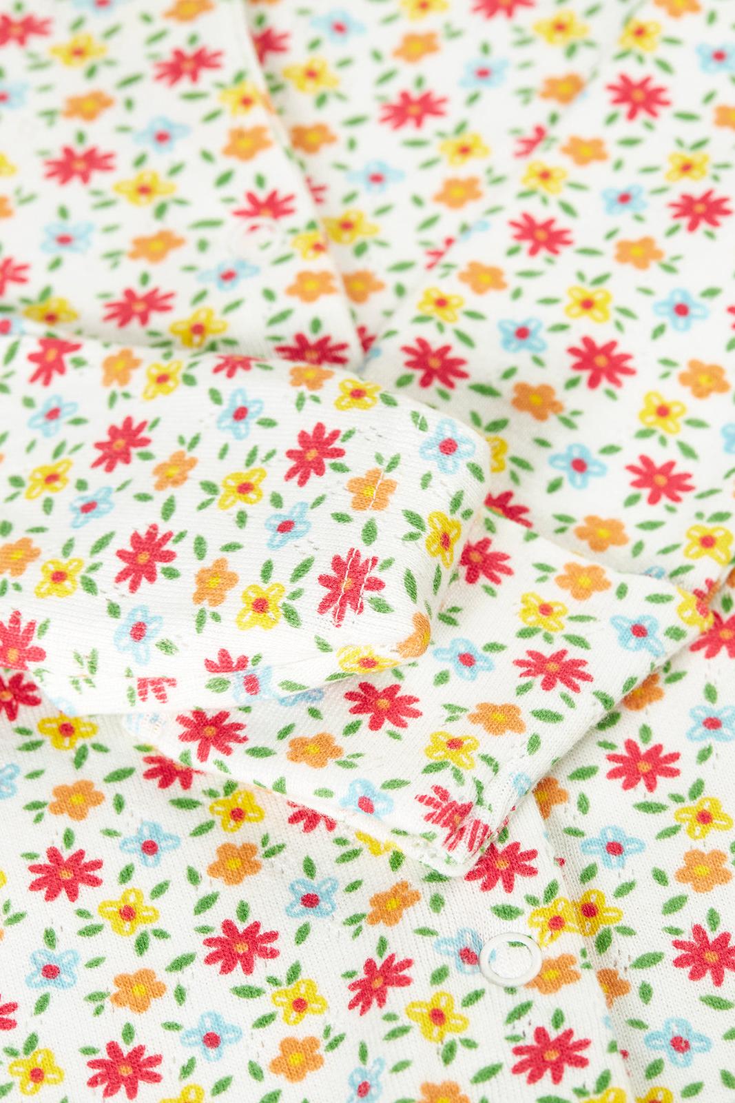 Floral patterned fabric with colorful flowers on a white background
